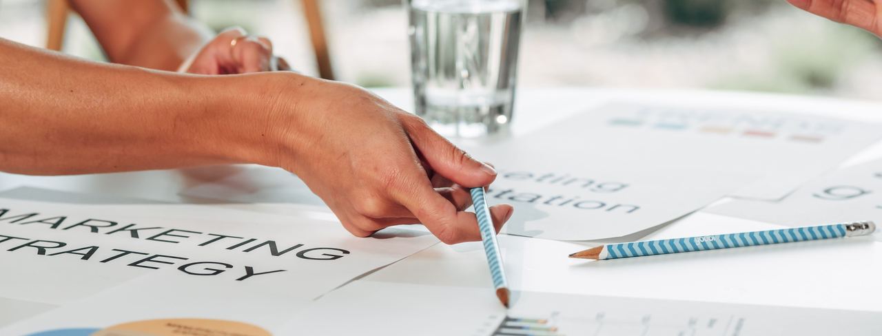 A marketing strategy document with charts on a table